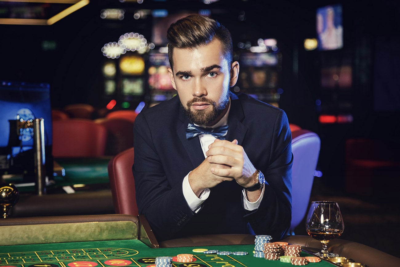 Handsome man playing roulette in the casino - SWAGGER Magazine