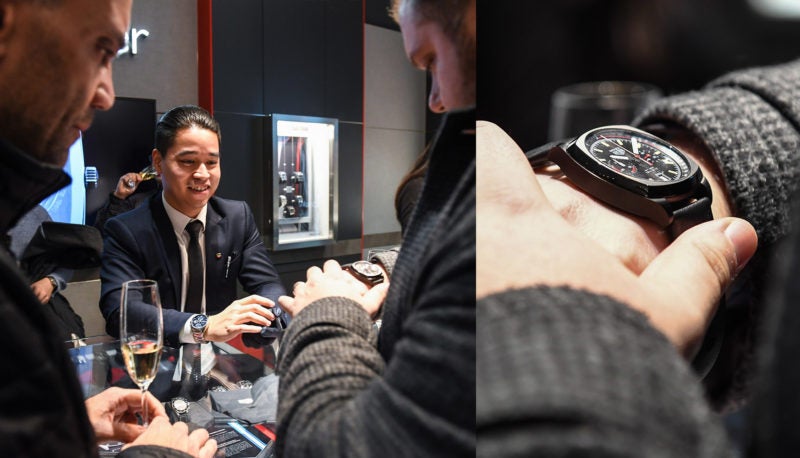 Guest trying on a TAG Heuer at the opening night event